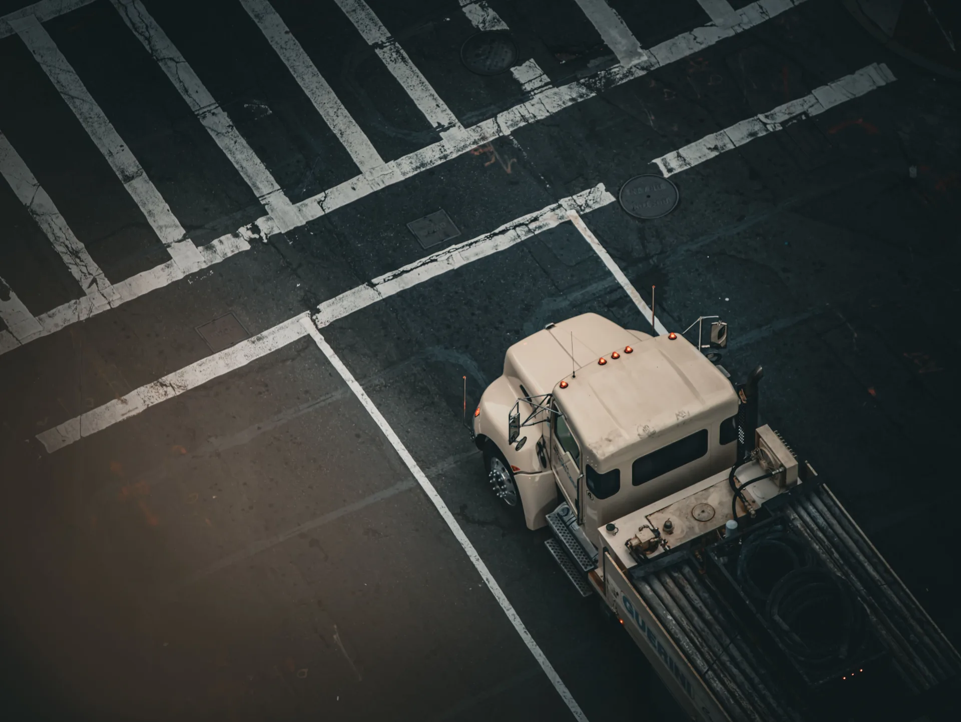 Aerial view of an Eric Logistics truck navigating a city intersection